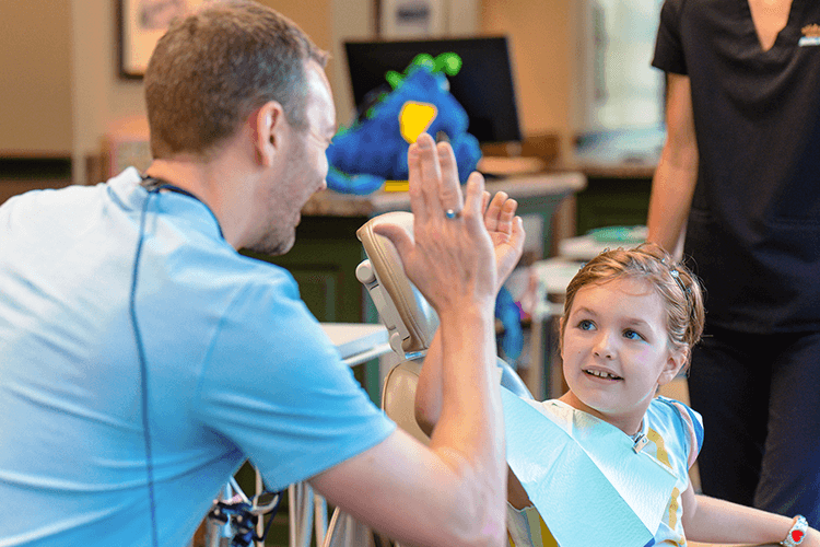 patient of wilderness station high fiving dr marty