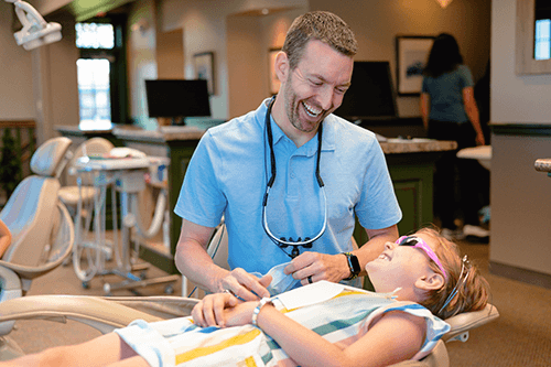 dr marty of wilderness station pediatric dentistry talking with patient