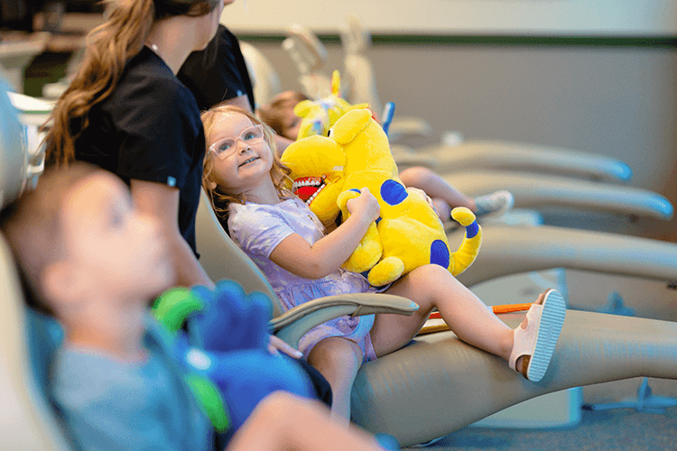 patient of wilderness station holding stuffed animal